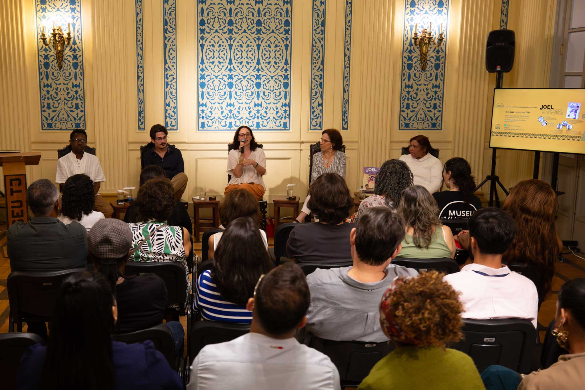 Maximiliano de Souza, museólogo; Giuliano de Miranda Junior, historiador; Mariana Warth, jornalista e editora do livro; Teresa Garbayo dos Santos, psicóloga, escritora e viúva de Joel; e Cintia Barreto, autora do livro e doutora em Literatura Brasileira